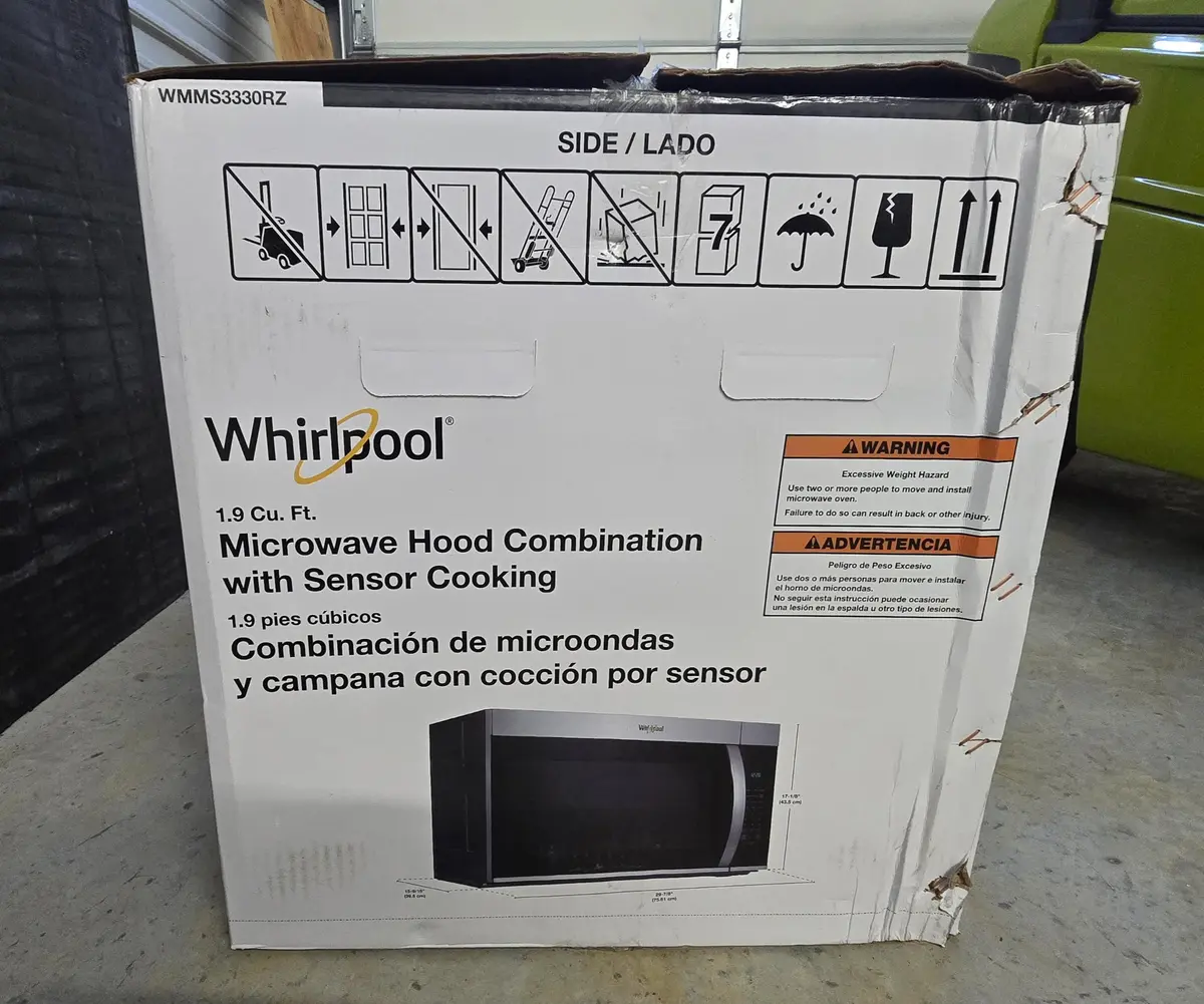 Whirlpool WMMS3330RZ 1.9 cu. ft. over-the-range microwave hood combination in its actual box